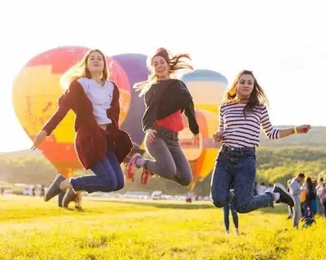 women-jumping-in-field.jpg